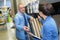 Couple shopping parquet in hardware store shop for construction