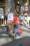 Couple shopping on Passeig de Grï¿½cia in the Eixample district, busy street in Barcelona, Spain, Europe