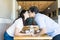 Couple Showing Affection By Kissing In Cafe