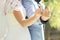 Couple showing middle fingers with wedding rings