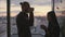 Couple silhouettes drinking coffee sunset place closeup. Unknown people talking