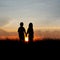 Couple silhouettes at sunset