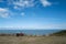 A couple sit on a bench which is facing out to sea in Tankerton, Whtistable.