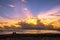 Couple sitting on the beach. Sunrise at the ocean in the Caribbean.  Puerto Plata