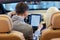 Couple sitting in cabriolet car with tablet pc