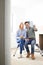 Couple Sitting In Property Being Renovated