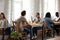 Couple sitting at table drinking coffee in cafe