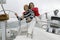 Couple Sitting On Yacht By Helm