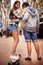 Couple, skateboarding and outdoor in city, happy and excited to learn together and romantic relationship. Cape town, fun
