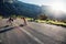 Couple skating down the road on a sunny day