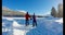 Couple skating on snowy landscape 4k