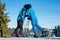 Couple skiers kissing on mountain top at sunny day