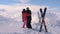 Couple Skiers In Love Kisses and Hugs on the Top of the Mountain