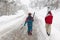 Couple of skiers on a snowy pathway. Winter sports