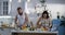 Couple slicing vegetables in the kitchen