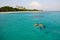 Couple snorkel in crystal water in Maldives