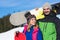 Couple With Snowboard Ski Resort Snow Winter Mountain Smiling Man And Woman Extreme Sport Vacation