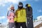 Couple of snowboarders, portrait with snowboard, persons wearing ski equipment