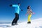 Couple snowboarding on hill. Winter vacation