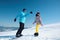 Couple snowboarding on snowy hill. Winter