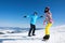 Couple snowboarding on snowy hill. Winter vacation