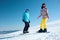 Couple snowboarding on snowy hill. Winter vacation