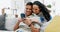 Couple, sofa and hug with smartphone search for video, movie and meme with happiness in home living room. Man, woman and