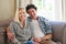 Couple, sofa and marriage with smile in portrait with love for relax in living room with confidence. People, couch and