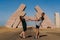 Couple stand near huge Gate of Allah, Ras Mohammed national park in Egypt. Desert