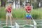 Couple on stand up paddle board in lake