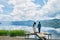 Couple stand on wasted platform looking away