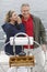 Couple Standing By Helm On Sailboat