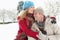 Couple Standing Outside In Snowy Landscape