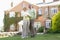 Couple Standing Outside Their House