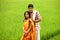Couple standing in a paddy field