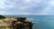 Couple standing on the rocky sea coast 4k