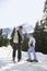 Couple Standing On Ski Slope