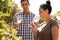 Couple standing together and sipping wine