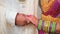 Couple standing together. Woman dressed in traditional Indian clothes, hindu wedding. Close up