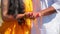 Couple standing together. Woman dressed in yellow traditional Indian clothes. move camera