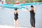 Couple with standup paddleboard on the beach