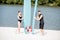 Couple with standup paddleboard on the beach