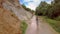 Couple in Stream against Hills and Forest Upper View