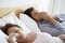 Couple Suffering From Colds In Bed