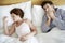 Couple Suffering From Colds In Bed