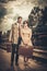 Couple with suitcases on train station platform