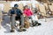 Couple sunbathing on snowy mountain