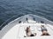 Couple Sunbathing On Yacht