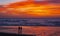 Couple at sunset on the Zurriola beach, Ciudad de Donostia, Euskadi