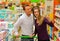 Couple in supermarket with shopping cart